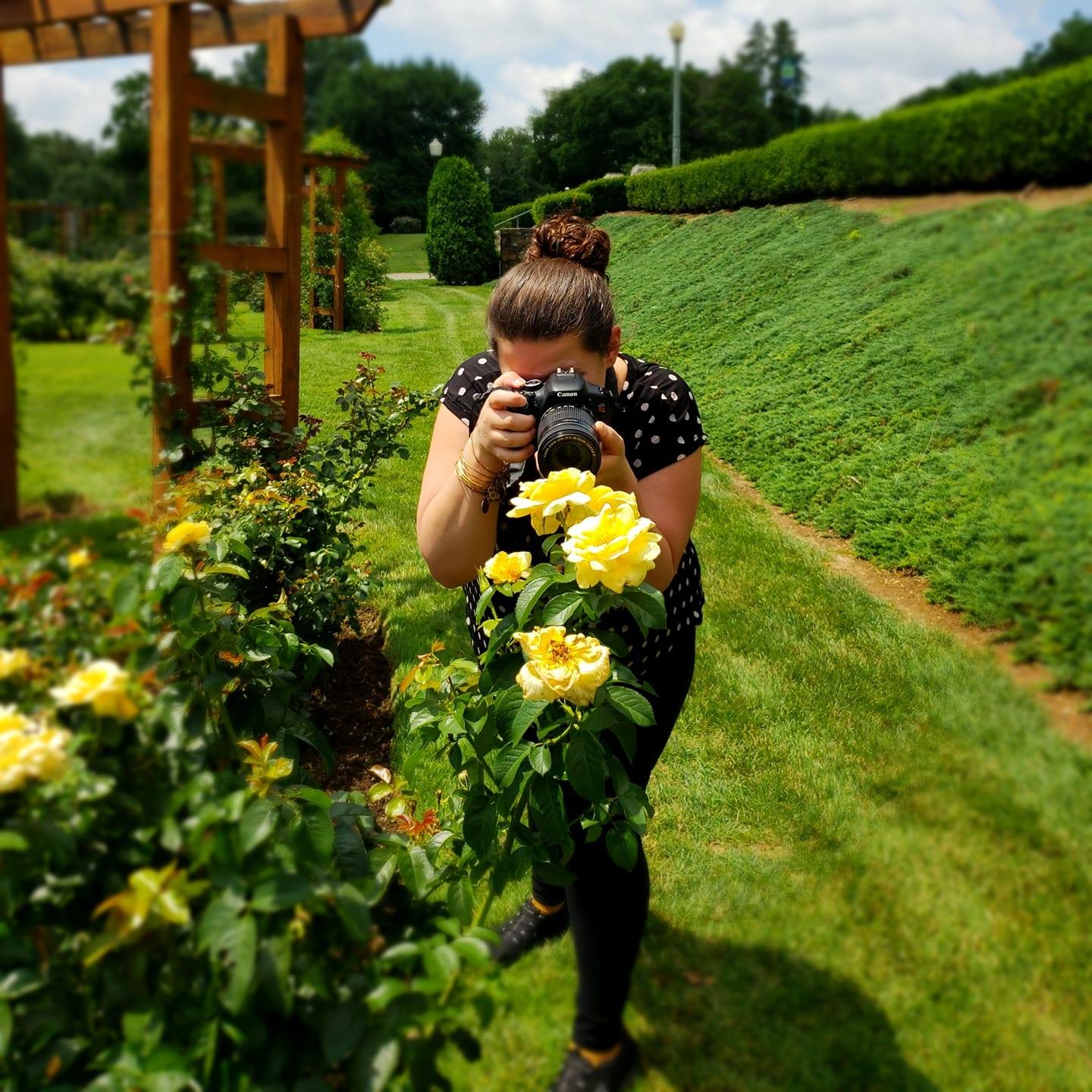 Allison Lee photographing flowers outdoors